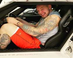As the wrestler has a huge height of 6 ft 8 inches he gets stuck in the normal car.
